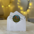 Load image into Gallery viewer, white envelope with Kind Coffee gift card with logo of "20 years of Kind Coffee"

